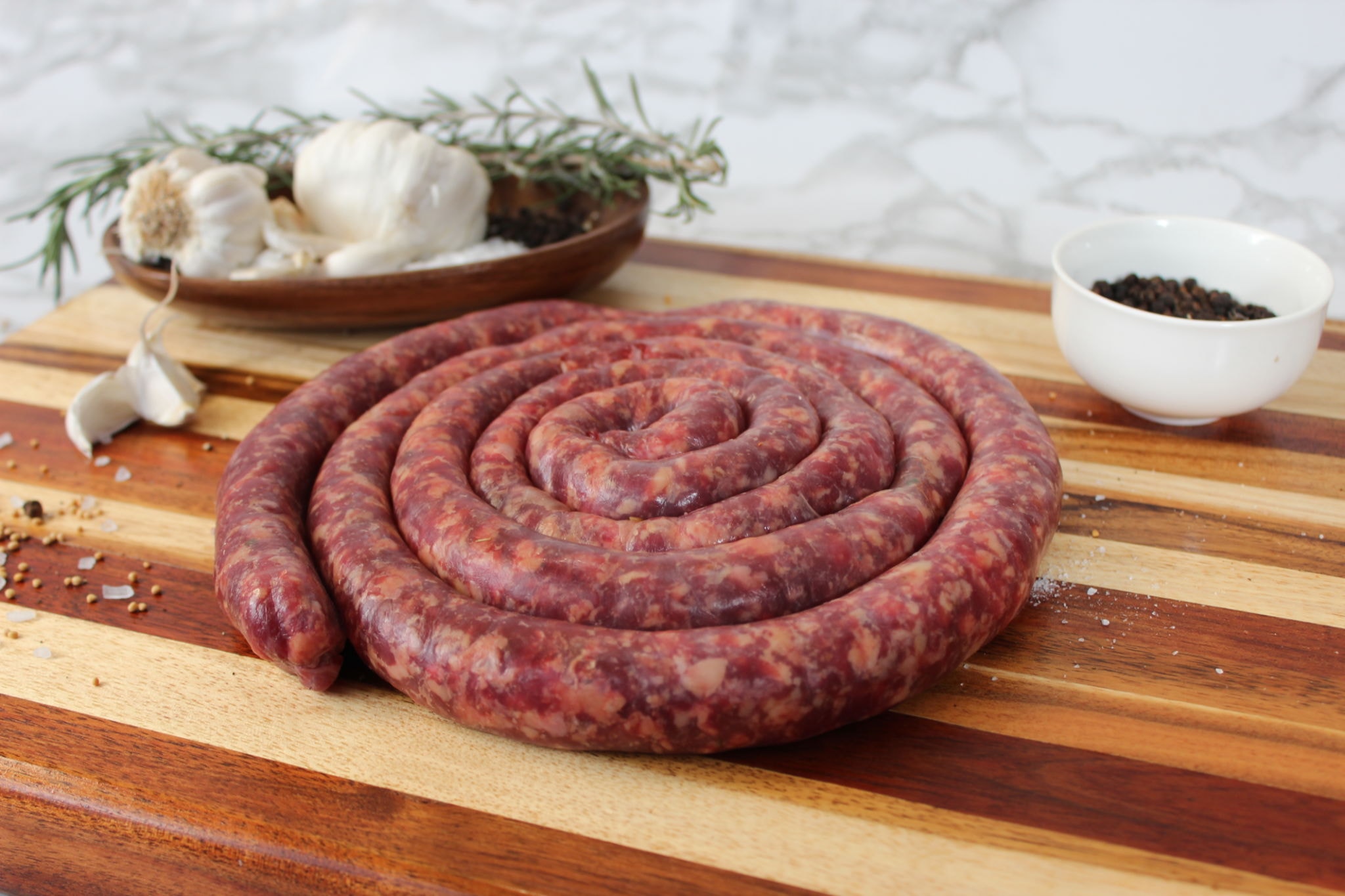 Coiled raw boerewors sausage with traditional spices